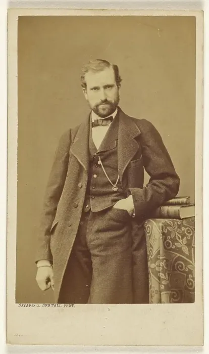 Framed Print : Unidentified well-dressed bearded man standing, elbow on books on a table, 1865-1870. Creator: Bayard & Bertall Framed Print : Unidentified well-dressed bearded man standing, elbow on books on a table, 1865-1870. Creator: Bayard & Bertall
