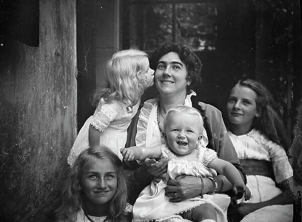 Unidentified woman with four children, portrait photograph, between 1911 and 1942. Creator: Arnold Genthe