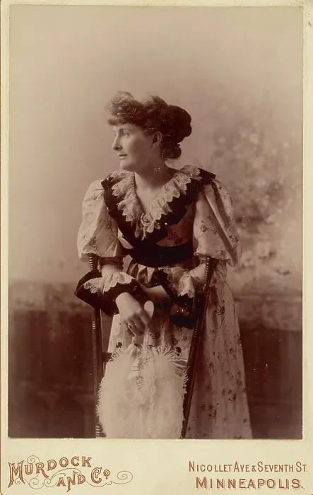 Framed Print : Unidentified woman in profile, leaning on a chair, holding a feather fan, about 1890. Creator: Murdock and Company Framed Print : Unidentified woman in profile, leaning on a chair, holding a feather fan, about 1890. Creator: Murdock and Company