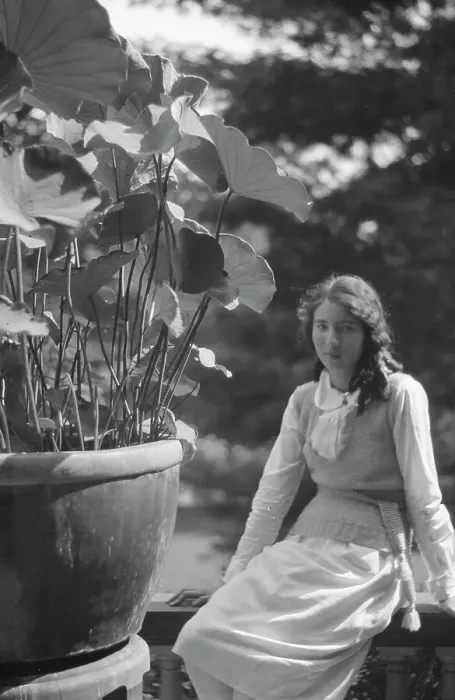 Framed Print : Unidentified woman seated in a garden next to a large potted plant, between 1917 and 1934. Creator: Arnold Genthe Framed Print : Unidentified woman seated in a garden next to a large potted plant, between 1917 and 1934. Creator: Arnold Genthe