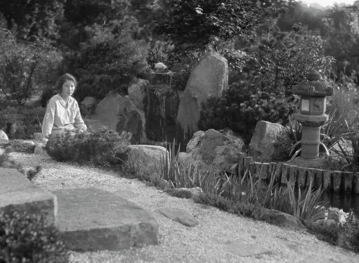 Framed Print : Unidentified woman seated in a garden next to a stream, possibly belonging to A.W. Bahr, c 1917-1934 Creator: Arnold Genthe Framed Print : Unidentified woman seated in a garden next to a stream, possibly belonging to A.W. Bahr, c 1917-1934 Creator: Arnold Genthe