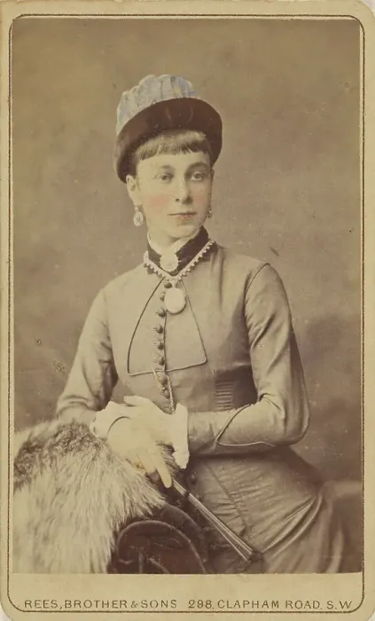 Framed Print : Unidentified woman standing, holding a fan, 1879. Creator: David Rees & Brother & Son Framed Print : Unidentified woman standing, holding a fan, 1879. Creator: David Rees & Brother & Son