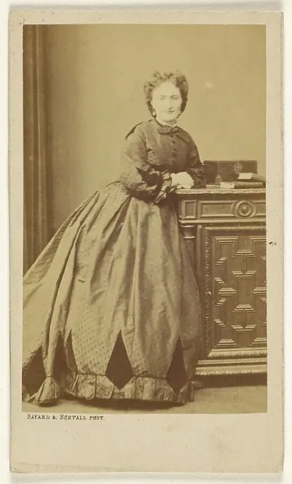 Framed Print : Unidentified woman standing, leaning against a credenza, about 1861. Creator: Bayard & Bertall Framed Print : Unidentified woman standing, leaning against a credenza, about 1861. Creator: Bayard & Bertall