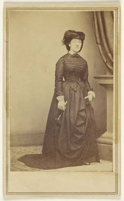 Framed Print : Unidentified woman wearing a hat and long dark dress, about 1868. Creator: Mathew Brady Framed Print : Unidentified woman wearing a hat and long dark dress, about 1868. Creator: Mathew Brady