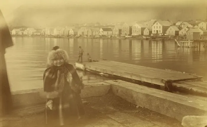 Framed Print : Unidentified young girl standing on wharf, with buildings along waterfront...1894 or 1895. Creator: Alfred Lee Broadbent Framed Print : Unidentified young girl standing on wharf, with buildings along waterfront...1894 or 1895. Creator: Alfred Lee Broadbent