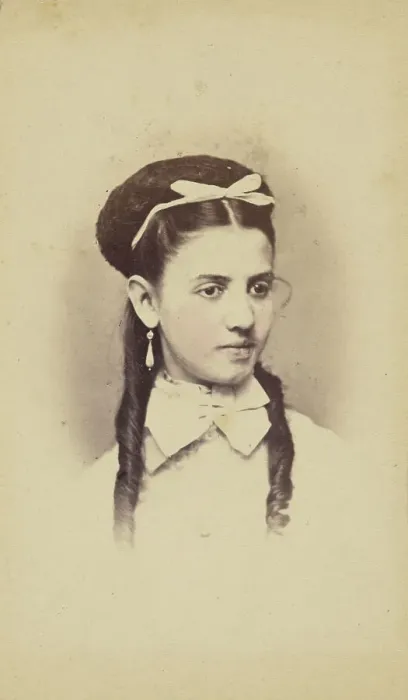 Framed Print : Unidentified young woman with two long curls, wearing a white bow in hair, 1870-1875. Creator: C.L. Lochman Framed Print : Unidentified young woman with two long curls, wearing a white bow in hair, 1870-1875. Creator: C.L. Lochman