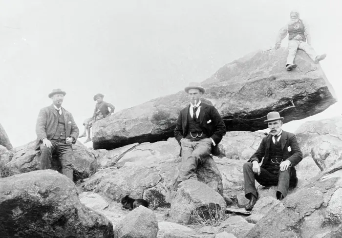 Framed Print : Unknown men and boy, unknown location posing on large rocks, c1900s Framed Print : Unknown men and boy, unknown location posing on large rocks, c1900s
