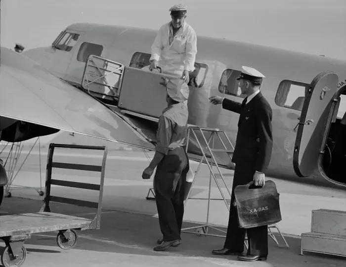 Framed Print : Unloading baggage for inspection...plane from Mexico, Glendale Airport, California, 1937. Creator: Dorothea Lange Framed Print : Unloading baggage for inspection...plane from Mexico, Glendale Airport, California, 1937. Creator: Dorothea Lange