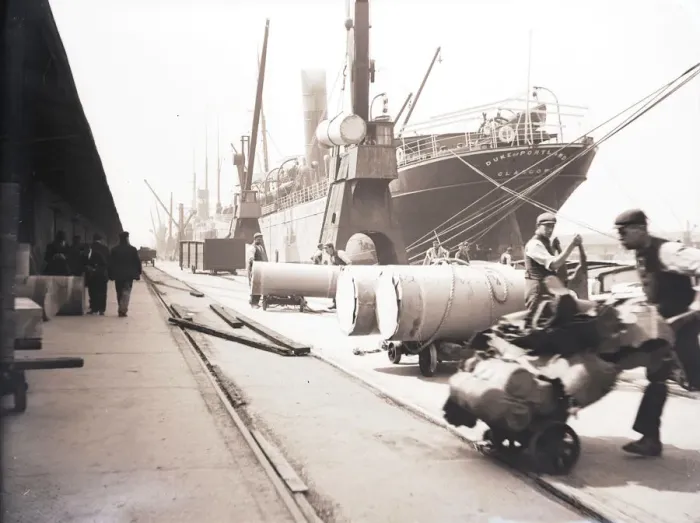 Framed Print : Unloading rolls of paper from a ship, London, c1905 Framed Print : Unloading rolls of paper from a ship, London, c1905