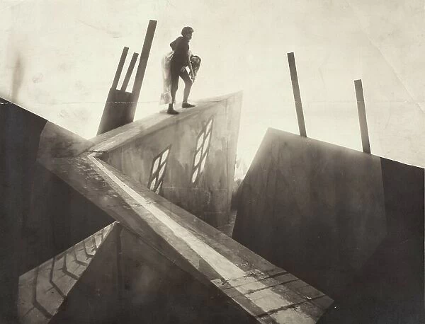 Untitled (Cesare [Conrad Veidt] Carrying Jane [Lil Dagover] across Rooftops), 1919. Creator: Anon