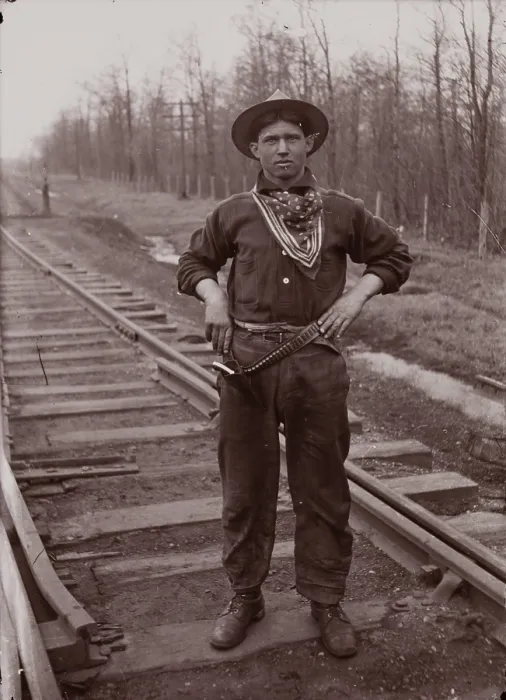 Framed Print : Untitled (man with pistol on railroad tracks, neg. #14), between 1910 and 1935, printed c1975. Creator: Wendell Hotter Framed Print : Untitled (man with pistol on railroad tracks, neg. #14), between 1910 and 1935, printed c1975. Creator: Wendell Hotter