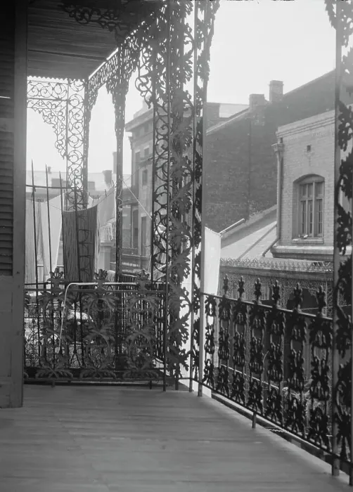 Framed Print : Upper level balconies with wrought iron on St. Peter Street, New Orleans, between 1920 and 1926. Creator: Arnold Genthe Framed Print : Upper level balconies with wrought iron on St. Peter Street, New Orleans, between 1920 and 1926. Creator: Arnold Genthe