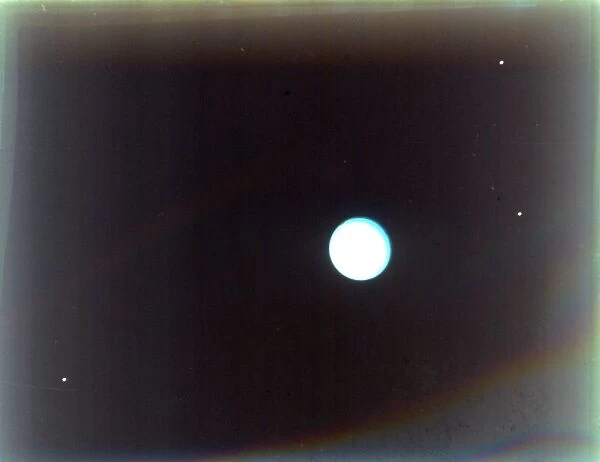 Uranus with satellites Miranda, Ariel and Umbriel, from Voyager 2, 24 January 1986