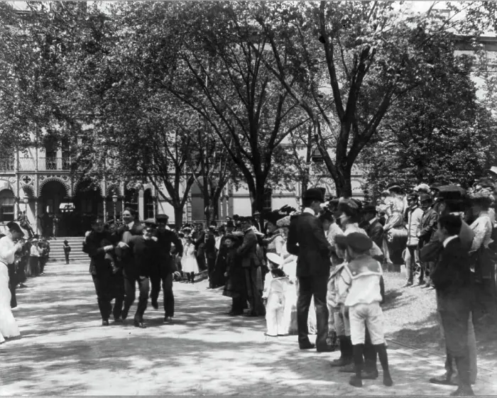 Framed Print : U.S. Naval Academy, Annapolis: 4 midshipmen carrying a man; crowd of guests along sidewalk, (1902?). Creator: Frances Benjamin Johnston Framed Print : U.S. Naval Academy, Annapolis: 4 midshipmen carrying a man; crowd of guests along sidewalk, (1902?). Creator: Frances Benjamin Johnston