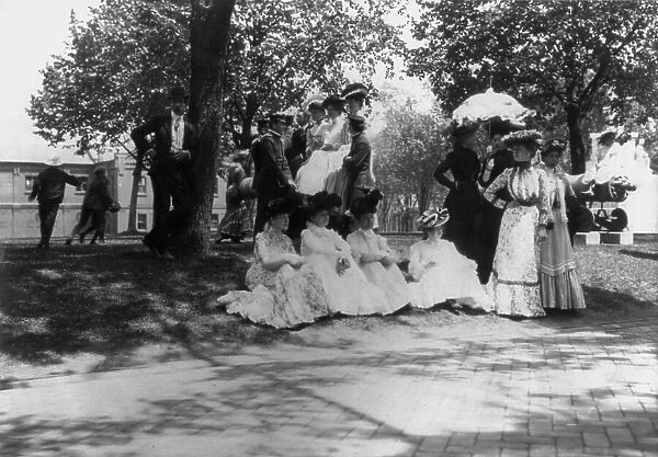 U.S. Naval Academy, Annapolis: cadets and women on lawn, (1902?). Creator: Frances Benjamin Johnston