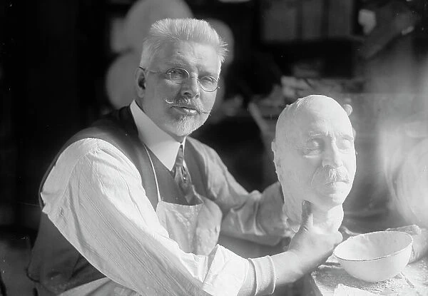 U.S.J. Dunbar with Death Mask of Admiral Dewey, 1917. Creator: Harris & Ewing. U.S.J. Dunbar with Death Mask of Admiral Dewey, 1917. Creator: Harris & Ewing