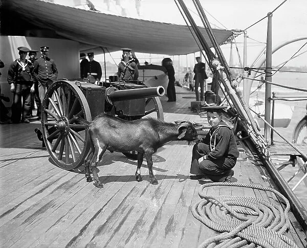 U.S.S. New York, Admiral Sampson's son and 'Pitch' the mascot, (1899?). Creator: Unknown. U.S.S. New York, Admiral Sampson's son and 'Pitch' the mascot, (1899?). Creator: Unknown