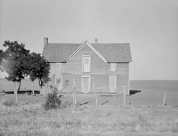 Vacant farmhouse in area of mechanization and drought near Olustee, Oklahoma, 1938. Creator: Dorothea Lange