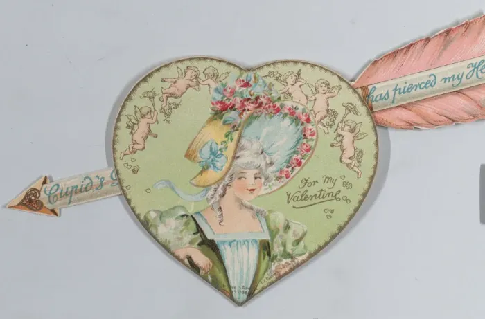 Framed Print : Valentine - Mechanical - Heart with arrow opens, image of a woman, ca. 1875. ca. 1875. Creator: Anon Framed Print : Valentine - Mechanical - Heart with arrow opens, image of a woman, ca. 1875. ca. 1875. Creator: Anon