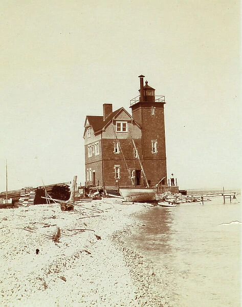 View of lighthouse from beach, Duluth, Minnesota, 1903. Creator: Frances Benjamin Johnston