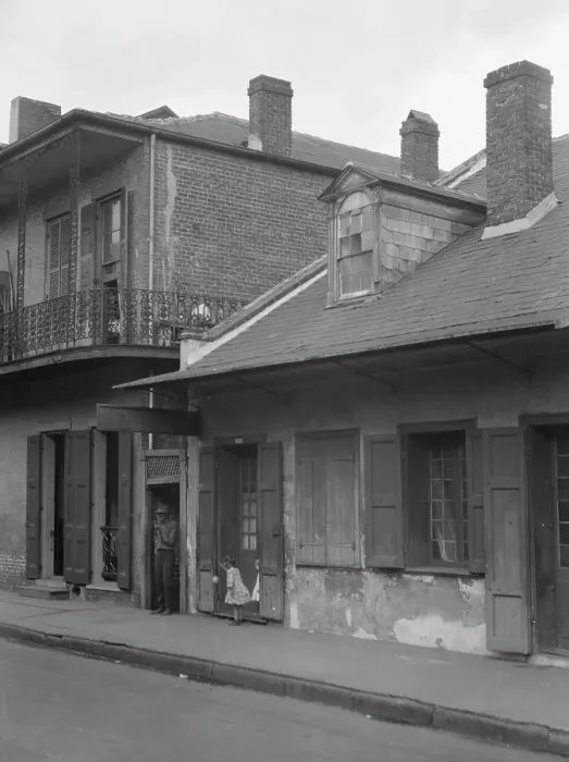 Framed Print : View from across street of two children standing in a doorway in the French Quarter... c1920-1926. Creator: Arnold Genthe Framed Print : View from across street of two children standing in a doorway in the French Quarter... c1920-1926. Creator: Arnold Genthe