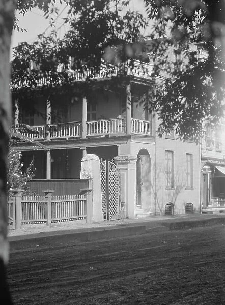 View from across street of a multi-story house, [25 Franklin Street], Charleston... c1920-1926. Creator: Arnold Genthe