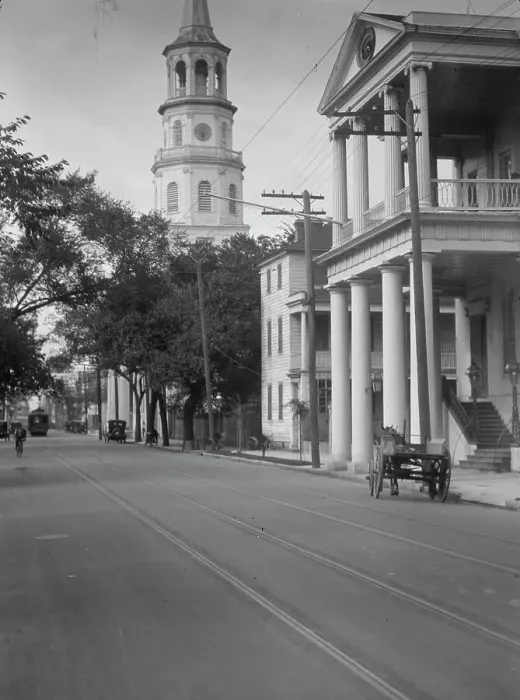 Framed Print : View down street to St. Michael's Church, Charleston, South Carolina, between 1920 and 1926. Creator: Arnold Genthe Framed Print : View down street to St. Michael's Church, Charleston, South Carolina, between 1920 and 1926. Creator: Arnold Genthe