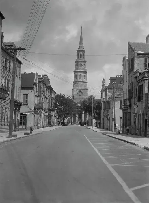 Framed Print : View down street to St. Philip's Church, Charleston, South Carolina, between 1920 and 1926. Creator: Arnold Genthe Framed Print : View down street to St. Philip's Church, Charleston, South Carolina, between 1920 and 1926. Creator: Arnold Genthe