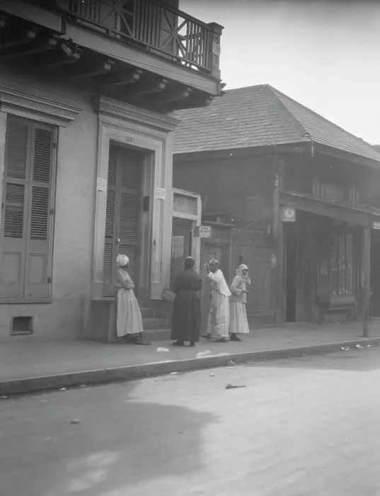 Framed Print : View from across street of four women talking, New Orleans, between 1920 and 1926. Creator: Arnold Genthe Framed Print : View from across street of four women talking, New Orleans, between 1920 and 1926. Creator: Arnold Genthe