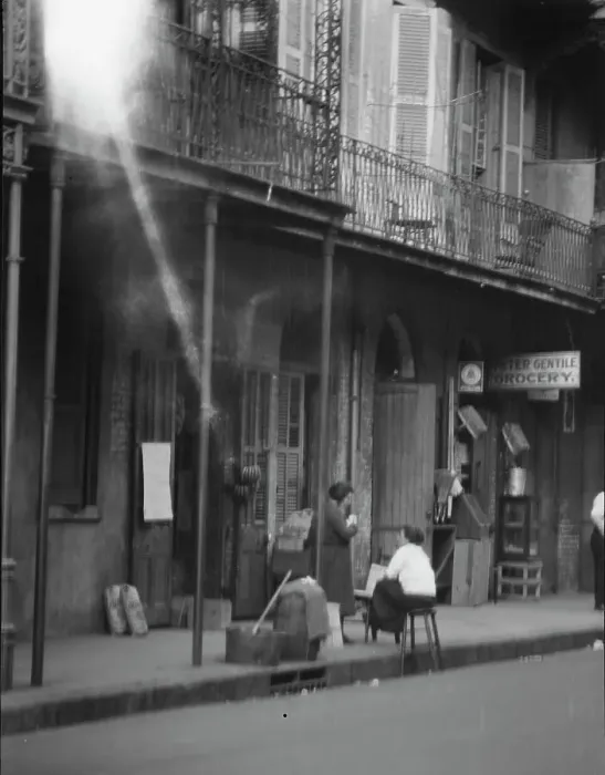 Framed Print : View from across street of two women talking, New Orleans, between 1920 and 1926. Creator: Arnold Genthe Framed Print : View from across street of two women talking, New Orleans, between 1920 and 1926. Creator: Arnold Genthe