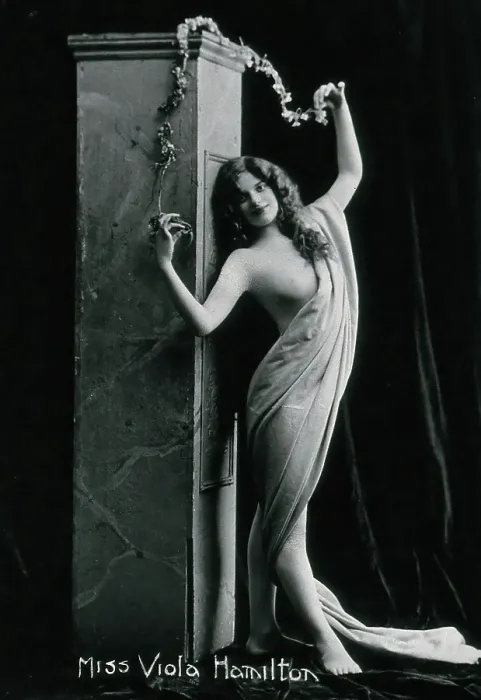 Framed Print : Viola Hamilton, posing in a classical attitude against a square column, early 20th century. Creator: Unknown Framed Print : Viola Hamilton, posing in a classical attitude against a square column, early 20th century. Creator: Unknown