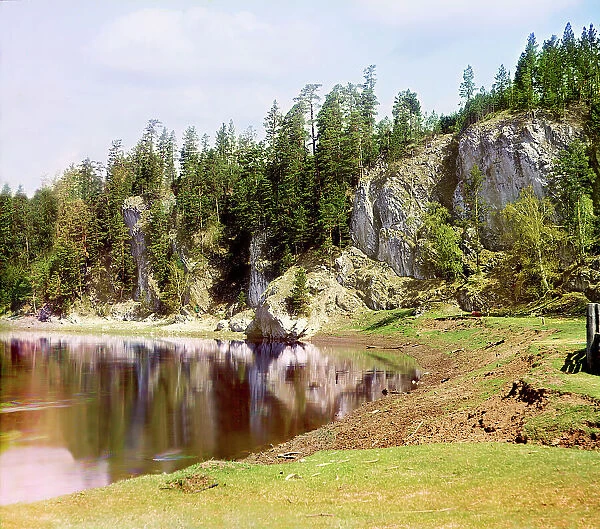 Vysokiy Rock below the village of Treki, Chusovaya River, 1912. Creator: Sergey Mikhaylovich Prokudin-Gorsky