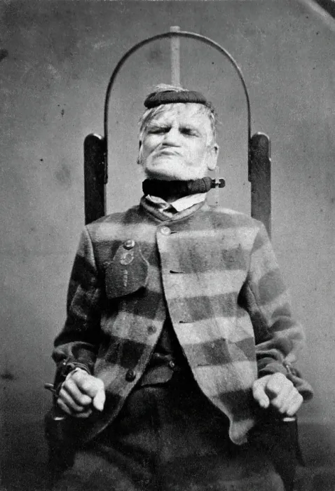 Framed Print : Wakefield Prison, Yorkshire: an elderly man, struggling against the restraint-chair in... c1869. Creator: Unknown Framed Print : Wakefield Prison, Yorkshire: an elderly man, struggling against the restraint-chair in... c1869. Creator: Unknown