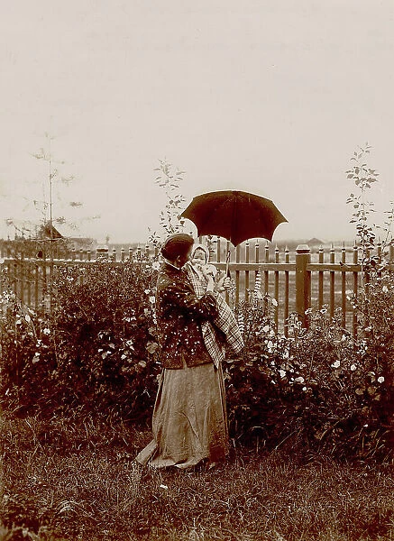 A walk in the garden at the Yudins' dacha in Tarakanovo, 1903. Creator: Unknown