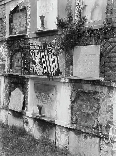 Wall tombs of the old St. Louis Cemetery, New Orleans, between 1920 and 1926. Creator: Arnold Genthe