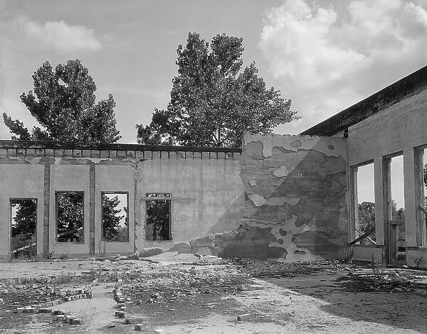 Some of the walls of the bank still stand at Fullerton, Louisiana, abandoned lumber town, 1937. Creator: Dorothea Lange