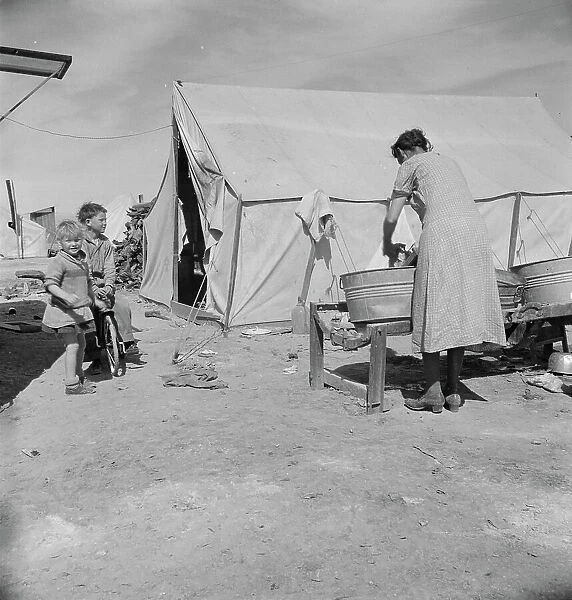 Washing facilities for families in migratory pea pickers camp, Imperial Valley, California, 1937. Creator: Dorothea Lange