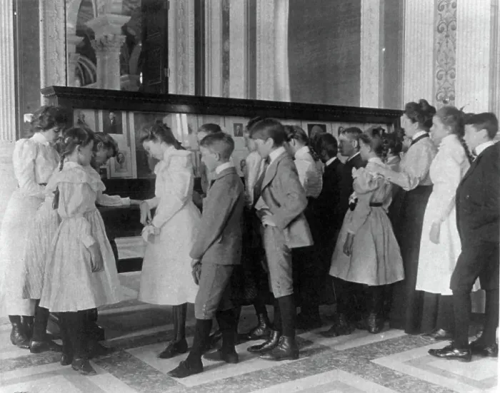 Framed Print : Washington, D.C. public schools - museum field trip - viewing exhibit case of George Wa... (1899?). Creator: Frances Benjamin Johnston Framed Print : Washington, D.C. public schools - museum field trip - viewing exhibit case of George Wa... (1899?). Creator: Frances Benjamin Johnston