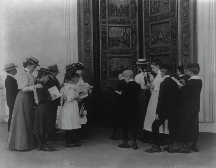 Framed Print : Washington, D.C. school children on field trip - examining the bronze Columbus door... (1899?). Creator: Frances Benjamin Johnston. Washington, D.C. school children on field trip - examining the bronze Columbus door... (1899?) Framed Print : Washington, D.C. school children on field trip - examining the bronze Columbus door... (1899?). Creator: Frances Benjamin Johnston. Washington, D.C. school children on field trip - examining the bronze Columbus door... (1899?)