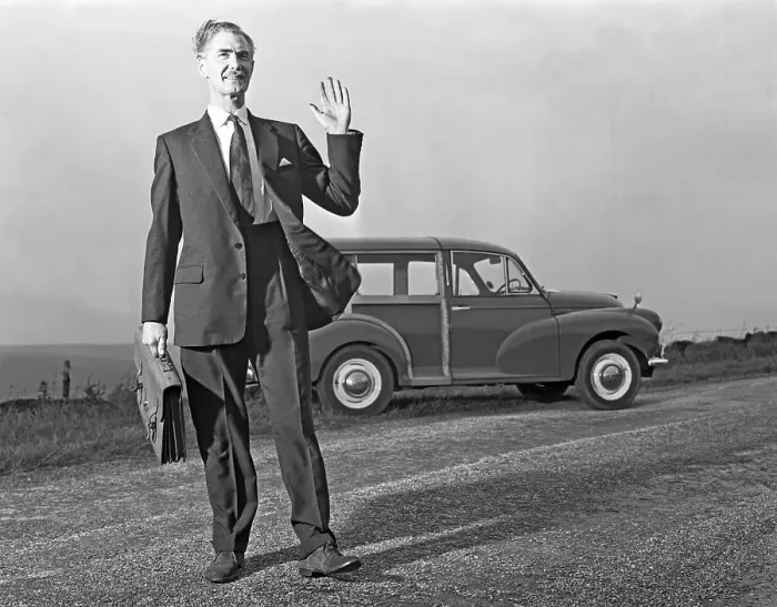 Framed Print : Waving Sales rep with a Moris Minor Shooting Brake, 3rd Aug 1963. Artist: Michael Walters Framed Print : Waving Sales rep with a Moris Minor Shooting Brake, 3rd Aug 1963. Artist: Michael Walters