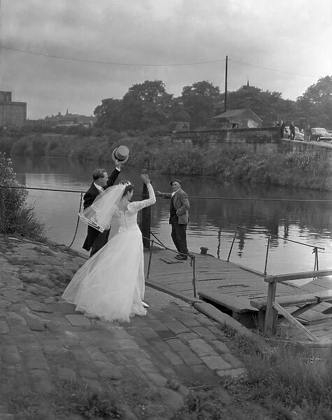 Wedding couple crossing the river Don, Mexborough, South Yorkshire, 1961. Artist