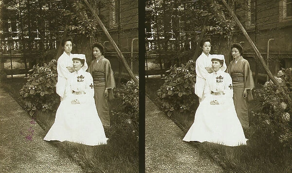 A western Red Cross female doctor(?) and two Japanese women posed in a garden, c1905. Creator: Underwood & Underwood. A western Red Cross female doctor(?) and two Japanese women posed in a garden, c1905. Creator: Underwood & Underwood