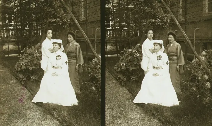 Framed Print : A western Red Cross female doctor(?) and two Japanese women posed in a garden, c1905. Creator: Underwood & Underwood. A western Red Cross female doctor(?) and two Japanese women posed in a garden, c1905. Creator: Underwood & Underwood