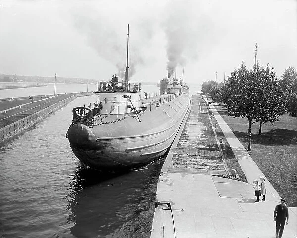 Whaleback entering Weitzel Lock, Sault Sainte Marie, Mich. between 1900 and 1910. Creator: Unknown