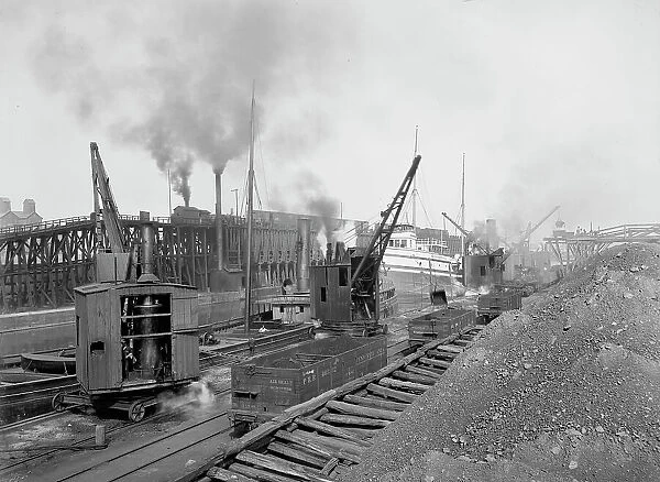 Whirleys unloading ore, Penna. R.R. [Pennsylvania Railroad] docks, Erie, Pa. ca 1900. Creator: William H. Jackson