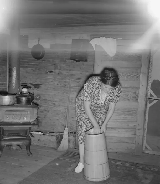 Framed Print : Wife of tobacco sharecropper cleaning butter churn, Person County, North Carolina, 1939. Creator: Dorothea Lange Framed Print : Wife of tobacco sharecropper cleaning butter churn, Person County, North Carolina, 1939. Creator: Dorothea Lange