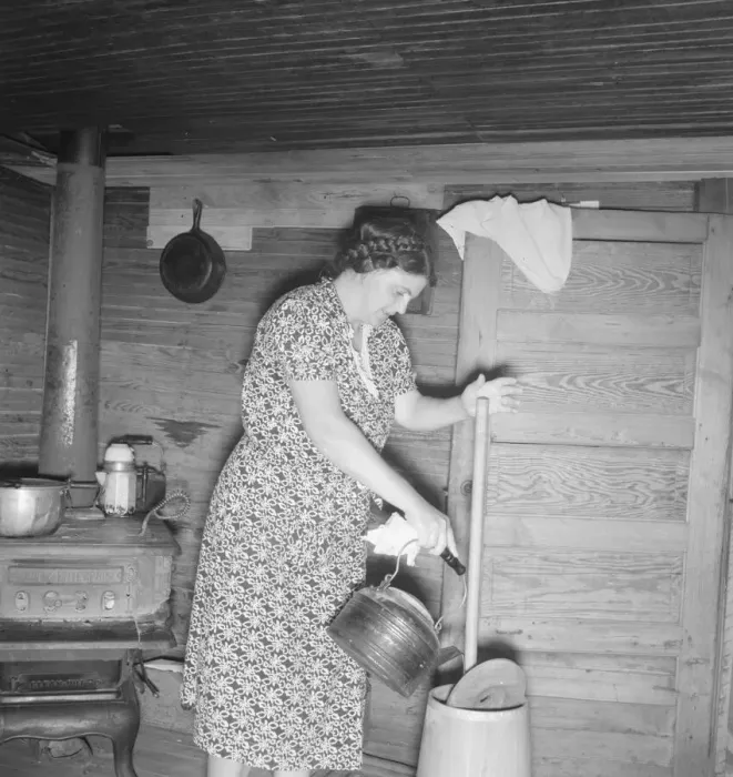 Framed Print : Wife of tobacco sharecropper cleaning butter churn, Person County, North Carolina, 1939. Creator: Dorothea Lange Framed Print : Wife of tobacco sharecropper cleaning butter churn, Person County, North Carolina, 1939. Creator: Dorothea Lange