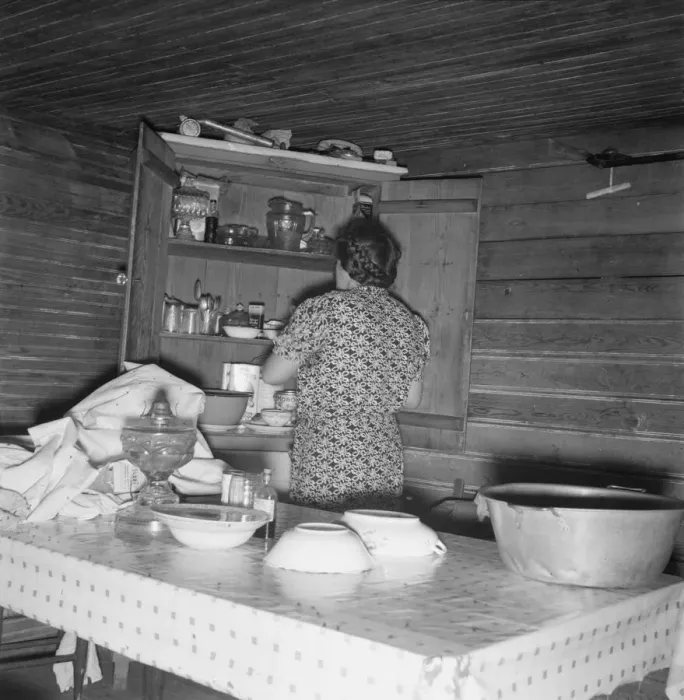 Framed Print : Wife of tobacco sharecropper putting breakfast dishes away. Person County, North Carolina, 1939. Creator: Dorothea Lange Framed Print : Wife of tobacco sharecropper putting breakfast dishes away. Person County, North Carolina, 1939. Creator: Dorothea Lange