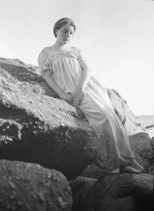 Framed Print : Wilson, Helen, Mrs. seated on rocks at the beach, between 1906 and 1928. Creator: Arnold Genthe Framed Print : Wilson, Helen, Mrs. seated on rocks at the beach, between 1906 and 1928. Creator: Arnold Genthe