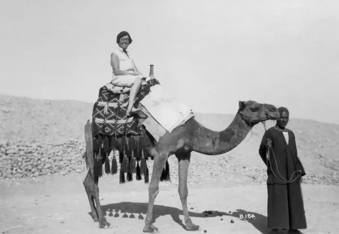 Framed Print : Woman on a camel tour, Egypt, c1920s-c1930s(?) Framed Print : Woman on a camel tour, Egypt, c1920s-c1930s(?)